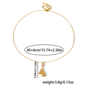 Detailed view of bear necklace pendant size showing pink heart and pearl accents