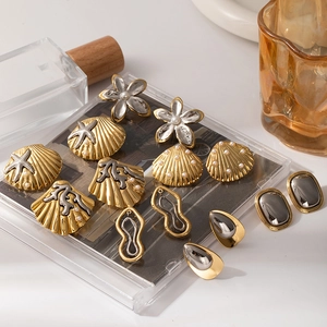 Elegante goud en zilveren oorbellen met oceaanthema, parels en zeester ontwerpen