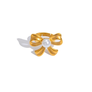 Elegant gold bow ring with white pearl in stainless steel with open adjustable band