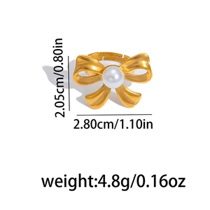 Matte gold bow ring with white faux pearl and dimensions showing 2.05cm by 2.80cm size