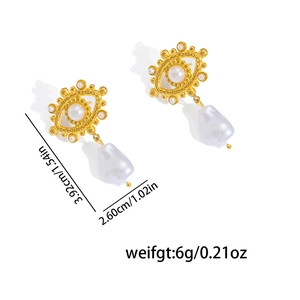 Detailed view of baroque pearl earrings with golden eye design and size measurements