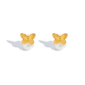 Elegant gold bow earrings with round white pearls on a minimalist white background