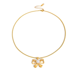 Detail of gold bow necklace with white pearl pendant and adjustable box chain