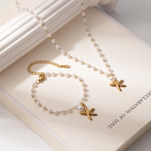 Set gioielli stella marina dorata e perle con collana e bracciale in acciaio inossidabile