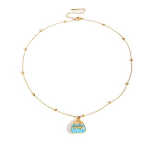 Gold beaded necklace featuring a blue handbag pendant with a bow and sparkling zircon