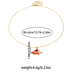 Detail of gold necklace with red hat pendant, white bow, pearl and size measurements