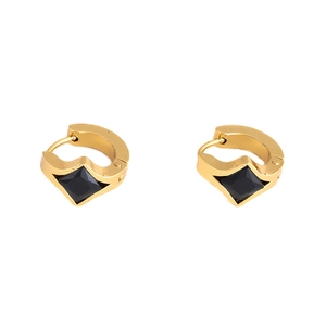Close-up of gold titanium steel hoop earrings with square-cut black zircon stone