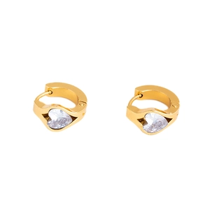 Detailed close-up of gold heart-shaped zircon earrings in a minimalist C-hoop style