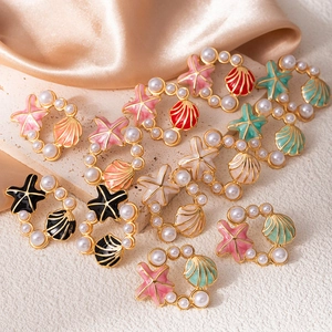 Boucles d'oreilles étoile de mer et coquillage avec perles en acier doré inoxydable