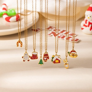 Detailed view of colorful Christmas necklace set with Santa, reindeer and tree charms