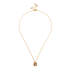 Détail d'un pendentif boîte cadeau de Noël doré avec émail rouge et vert et nœud