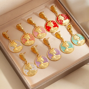 Detail of vintage enamel cameo earrings with female portraits in colorful finishes