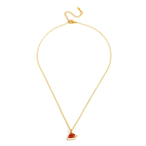 Detailed macro view of a gold-toned necklace featuring a festive red and white Santa hat pendant