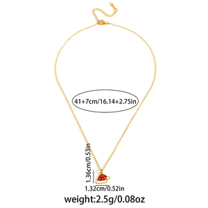 Detailed view of gold necklace with red Christmas hat pendant showing exact dimensions