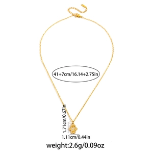 Detailed view of gingerbread man pendant with chain length and weight specifications