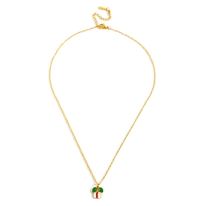 Detailed view of golden necklace with a white enamel gift box pendant and green bow charm