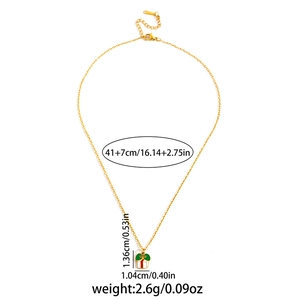 Golden cross chain necklace with a festive red and green enamel gift box pendant charm