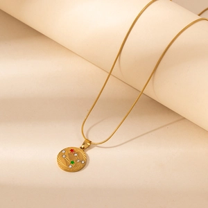 Gold snake chain necklace with zodiac pendant featuring rhinestones and star elements