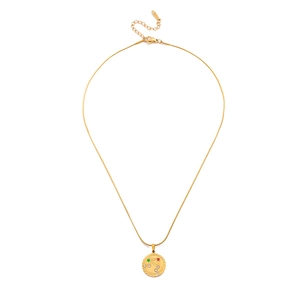 Detail of gold snake chain with a round constellation pendant and zircon inlay