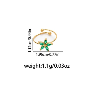 Detailed view of adjustable gold titanium ring with green zircon flower and dimensions