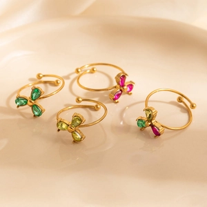 Set of four adjustable gold-plated rings featuring colorful teardrop zircon clover petals