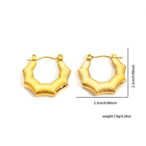 Detail of gold-plated starburst hoop earrings with hammered texture and 2.3cm size scale