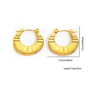 Detailed size view of golden twisted titanium steel earrings with radial texture