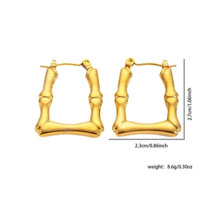 Detailed view of gold twist hoop earrings showing size dimensions and metal texture