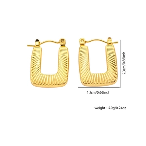 Detail of gold U-shaped earrings with radial texture and dimensions 2.3cm by 1.7cm