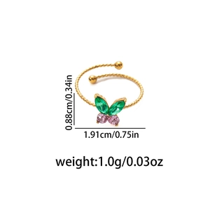 Gold stainless steel twisted ring with butterfly zircon stone and green gemstone wings