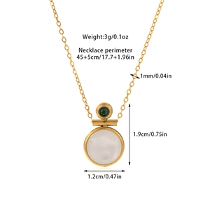 Detail of 18k gold plated necklace featuring white cat eye stone and green zircon pendant