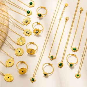 Vintage gold stainless steel jewelry set featuring malachite stones and bohemian rings