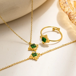 French vintage jewelry set with emerald green square stones and gold stainless steel finish