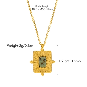 Detail of emerald green stone pendant with golden sunburst texture and size specs