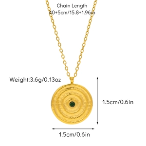 Detailed view of an 18K gold-plated necklace featuring a round green gemstone pendant