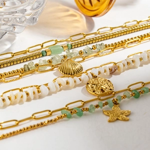 Bohemian gold starfish and shell bracelet set with natural green stones and round charms