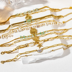 Bohemian gold chain bracelets set with natural stones, starfish, and seashell pendants