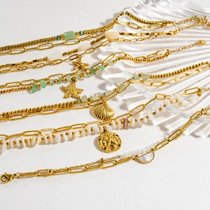 Golden sea theme jewelry set with starfish, shell charms and green natural stone beads