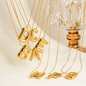 Polished 3D balloon alphabet necklaces in gold finish featuring various letters