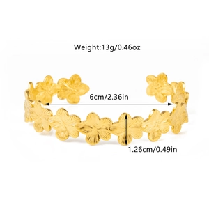 Macro detail of 18K gold plated floral open bangle with dimensions and weight info
