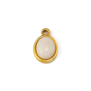 Macro detail of oval white natural stone pendant with polished gold-plated stainless steel frame