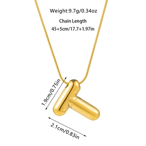 Detail view of golden bubble letter T necklace pendant with specific size and weight data