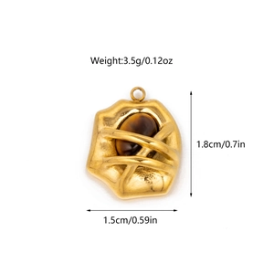 Detail view of gold tiger eye stone pendant with measurements 1.8cm by 1.5cm and 3.5g weight