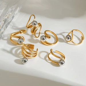 Detail of six-piece mixed gold and silver metal rings with twisted wires and polished beads