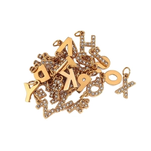 Gold 18k plated stainless steel alphabet pendants with rhinestone accents and smooth finish