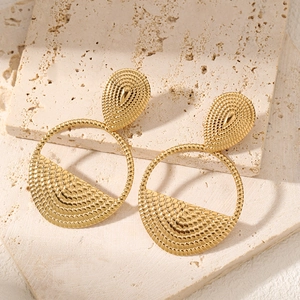 French vintage style golden teardrop stud earrings with textured circular pendants