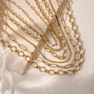18K gold plated stainless steel layered necklace set featuring snake and curb chain styles