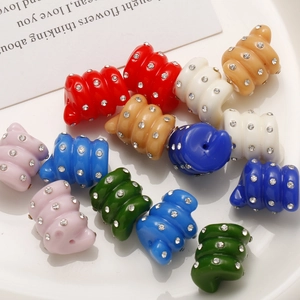Macro shot of colorful rhinestone croissant beads for DIY jewelry and hair accessories