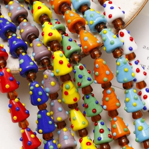 Detailed close-up of colorful polka dot glass lampwork beads for DIY jewelry making