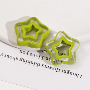 Macro shot of colorful hollow star resin charms for DIY earrings and hair accessories